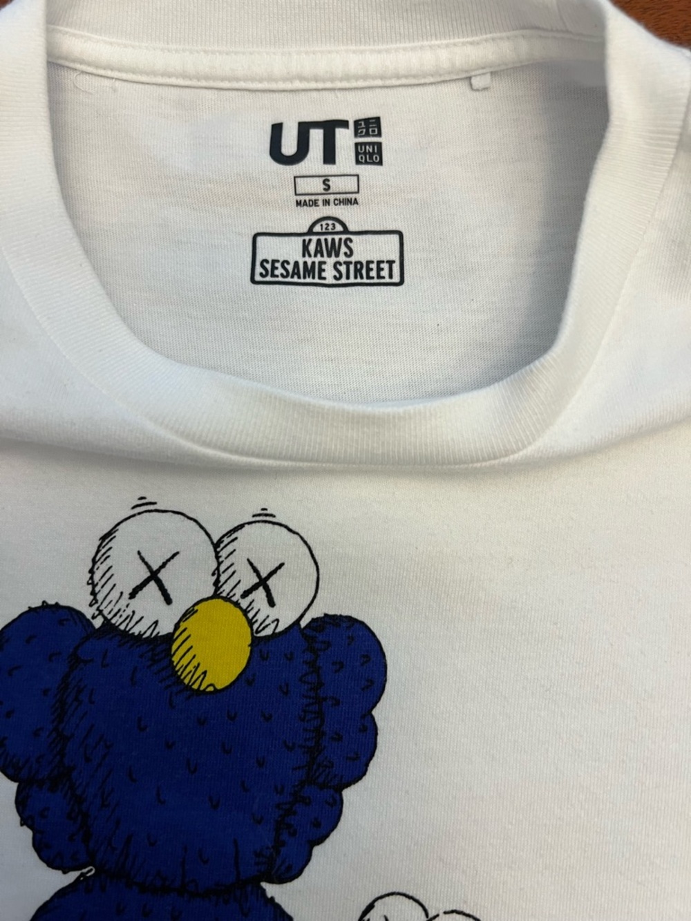 KAWS White Tee with Blue & Orange Character Graphic - Picture 2 of 3